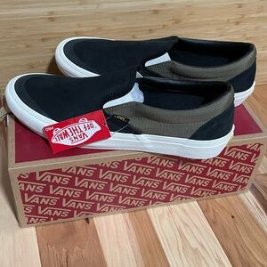 Vans Black Sneakers with Slip-On Design and White Sole